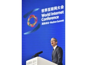Apple's CEO Tim Cook delivers a speech at the opening ceremony of the Fourth World Internet Conference in Wuzhen town in Tongxiang, East China's Zhejiang province, Sunday Dec. 03, 2017. (Chinatopix Via AP)