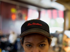Some Tim Hortons franchisees have implemented hiring freezes, cut hours of existing workers, eliminated paid breaks and boosted benefits costs to help offset the minimum wage hike.