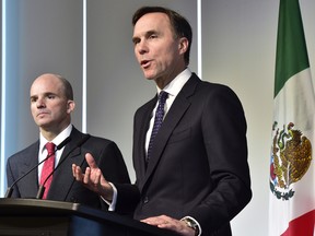Finance Minister Bill Morneau (right) and his Mexican counterpart Jose Antonio Gonzalez Anaya held talks in Toronto.