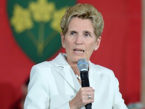 Kathleen Wynne posted a statement on social media Friday that linked to a report about apparent benefits cuts at certain Tim Hortons locations in Whitby, Ont., and Ajax, Ont.