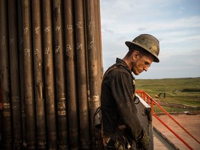 Ray Gerish, a floor hand for Raven Drilling, works on an oil rig drilling into the Bakken shale formation in North Dakota. Canada is looking to its own shale fields to repair the economic damage caused by a surge in U.S. oil.