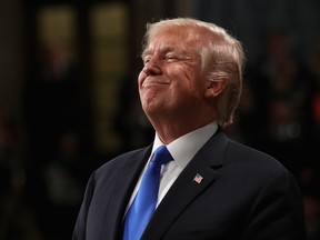 U.S. President Donald Trump smiles while delivering a State of the Union address to a joint session of Congress at the U.S. Capitol in Washington, D.C., U.S., on Tuesday, Jan. 30, 2018.