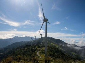 FILES) This file photo taken on October 23, 2015 shows wind mills of the National Power and Light Company (NPLC) in Santa Ana, Costa Rica.   Costa Rica expects to conclude in 2015 an energy matrix made in a 97.1% of renewable sources, what would make the Central American country one of the cleanest in the world, aiming at reducing carbon emissions to curb global warming.  An ambitious goal to limit planetary warming to 1.5 degrees Celsius is still within reach, said researchers September 18, 2017, who calculated humanity may have a larger allowable "budget" for burning carbon than previously thought. / AFP PHOTO / EZEQUIEL BECERRAEZEQUIEL BECERRA/AFP/Getty Images