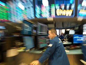 Traders work on the floor at the New York Stock Exchange.