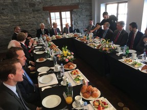 A group of Canadian and American politicians gather for a breakfast conversation about NAFTA during the current round of talks in Montreal, on Saturday, Jan. 27, 2018.