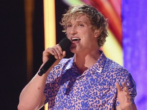 FILE - In this Aug. 13, 2017, file photo, Logan Paul introduces a performance by Kyle & Lil Yachty and Rita Ora at the Teen Choice Awards at the Galen Center in Los Angeles. YouTube says it has removed blogger Logan Paul's channels from Google Preferred and will not feature him in the new season of "Foursome." Paul's new video blogs also are on hold after he shared a video on YouTube that appeared to show a body hanging in a Japanese forest that is said to be a suicide spot.