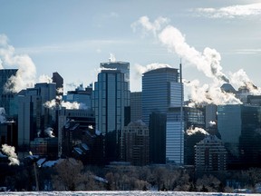 Exhaust plumes from buildings in downtown Calgary on Jan. 2, 2017. The province was on its second day of its new carbon tax.