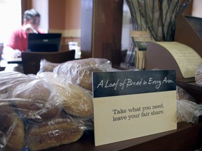 FILE - In this May 18, 2010 file photo, loaves of bread sits on a table at St. Louis Bread Co. Cares Community Cafe, part of Panera, in Clayton, Mo. The restaurant, where patrons pay as much or little as they want for a meal, is closing its doors Tuesday, Jan. 9, 2018. Founder and executive chairman Ron Shaich said it is closing because it was on a month-to-month lease and the store required a big investment.