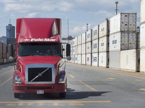 A truck moves through the South End Container Terminal in Halifax on Wednesday, July 27, 2016. The unemployment rate fell to its lowest level in more than 40 years as Canada closed out a calendar year that saw it produce jobs at a pace not seen since 2002. Employment also increased in other services, educational services and transportation and warehousing.