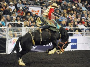 Dustin Flundra of Pincher Creek, Alta. wins the overall Saddle Bronc Riding title at the Canadian Finals Rodeo in Edmonton, Alta., on Sunday, November, 14, 2010. The Oilers Entertainment Group has decided it will not submit a bid to keep the CFR in the Alberta capital.