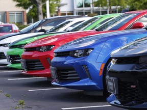 In this Wednesday, April 26, 2017, photo, Chevrolet Camaros are lined up in the lot of a Chevrolet dealership in Richmond, Va. A new poll sponsored by Canadian automobile dealers suggests millennials aren't keen to pursue careers in a sector that has seen vehicle sales reach a record high.