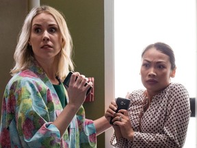 Actresses Siobhan Murphy, left, and Nhi Do are shown in a scene from the Canadian YouTube series "Upstairs Amy". Viewers who stumble across the series might not realize it at first, but beneath the comic foibles of its working mom star they're watching an elaborately constructed advertisement.