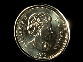 The Canadian dollar was trading at 79.78 cents US, up from Friday's average price of 79.71 cents US. A loonie is pictured in North Vancouver on Dec. 31, 2013.