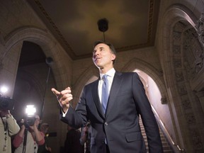 Finance Minister Bill Morneau arrives to talk to media on tax changes for small businesses in Ottawa on Wednesday, Dec. 13, 2017. After months of battling controversies, Bill Morneau's spring budget has the potential to blunt some criticism by showing that a return to balanced books could be within striking distance in a few years.