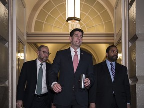 Speaker of the House Paul Ryan, R-Wis., arrives for a meeting of fellow Republicans on the first morning of a government shutdown after a divided Senate rejected a funding measure, at the Capitol in Washington, Saturday, Jan. 20, 2018.