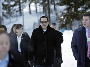 Steven Mnuchin, United States Secretary of the Treasury, walks through the snow during the annual meeting of the World Economic Forum in Davos, Switzerland, Wednesday, Jan. 24, 2018.
