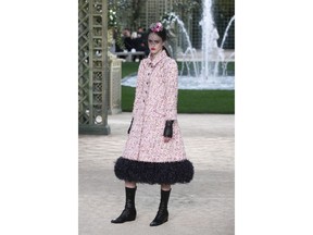 A model wears a creation for the Chanel Haute Couture Spring-Summer 2018 fashion collection presented in Paris, Tuesday, Jan. 23, 2018.
