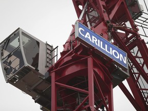 A crane bearing the name of Carillion, at a construction site in central London, Monday Jan. 15, 2018, as the construction and services giant Carillion has gone into liquidation.  In a statement released Monday, Carillion says it had no choice but to go into liquidation after weekend talks with creditors and government officials failed.