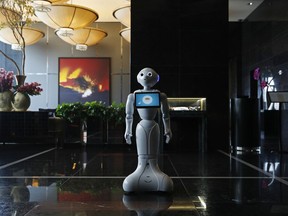 In this Nov. 15, 2017, photo, a robot named Pepper stands in the lobby of the Mandarin Oriental in Las Vegas. Pepper is programmed to interact with guests and answer pre-programmed questions.