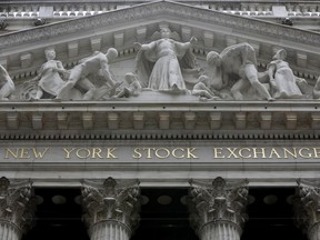 FILE - This Thursday, Oct. 2, 2014, file photo, shows the facade of the New York Stock Exchange. U.S. stock indexes took a small step back from their record levels on Monday, Jan. 8, 2018, as their momentum slowed following a torrid start to the year.