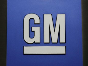 FILE - This Jan. 25, 2010, file photo, shows a General Motors Co. logo at a news conference in Detroit. GM said Tuesday, Jan. 16, 2018, it expects strong sales in North America and China to sustain its profit through 2018.