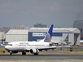FILE - In this Sept. 9, 2015, file photo, a United Airlines jet lands at Newark Liberty International Airport in Newark, N.J. United Continental Holdings, Inc. reports earnings, Tuesday, Jan. 23, 2018.