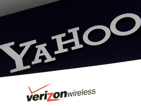 FILE - This Monday, July 25, 2016, file photo shows Yahoo and Verizon logos on a laptop, in North Andover, Mass. Verizon is pushing further into sports streaming with a new NBA deal that will let Yahoo users watch some out-of-market games.