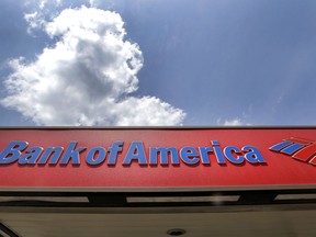 FILE - This Monday, July 18, 2016, file photo shows the top of a Bank of America ATM booth, in Woburn, Mass. Bank of America Corp. reports earnings, Wednesday, Jan. 17, 2018.