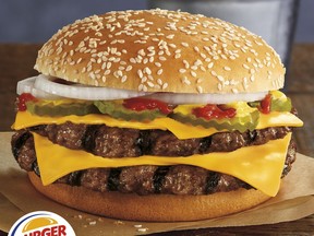 This photo provided by Burger King shows the restaurant's new Double Quarter Pound King burger. Burger King is looking to start a beef with McDonald's by launching its own quarter pound burger. The fast food company says the Double Quarter Pound King will hit restaurants nationwide Thursday, Jan. 18, 2018. (Burger King Corp. via AP)