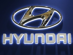 FILE - This Thursday, Feb. 11, 2016, file photo shows the Hyundai logo on display at the Pittsburgh International Auto Show in Pittsburgh. Hyundai and Volkswagen each say they're partnering with a U.S. autonomous vehicle tech firm led by former executives from Google, Tesla and Uber. On Thursday, Jan. 4, 2018, the companies announced partnerships with Aurora Innovation, started in 2017 by ex-Google autonomous car chief Chris Urmson and others.