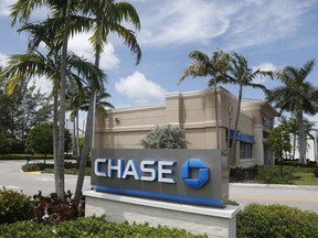 FILE - This Wednesday, Aug. 17, 2016, file photo, shows a Chase bank branch in North Miami Beach, Fla. JPMorgan Chase & Co. reports earnings, Friday, Jan. 12, 2018.