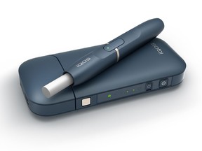 This undated image provided by Philip Morris in January 2018 shows the company's iQOS product. U.S. government experts have rejected a proposal from Philip Morris International to sell its "heat-not-burn" tobacco device as a lower-risk alternative to cigarettes that reduces disease. But the panel of advisers to the Food and Drug Administration endorsed a lesser claim that the product reduces exposure to harmful chemicals in cigarettes. The mixed review suggests Philip Morris will be able to market its device to U.S. smokers, but on limited terms.  (Philip Morris via AP)