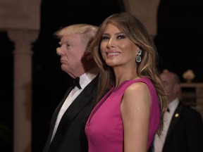 FILE- In this Feb. 4, 2017, file photo, President Donald Trump and first lady Melania Trump arrive for the 60th annual Red Cross Gala at Trump's Mar-a-Lago resort in Palm Beach, Fla.
