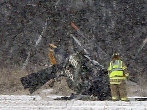 Police and emergency crews respond to a fatal helicopter crash in a field near State Rt. 163 and Pemberville Road in Troy Township, Wood County, Ohio, on Monday, Jan. 15, 2018.