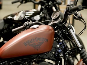 This Wednesday, April 26, 2017, photo shows the Harley-Davidson name on the gas tank of a Harley-Davidson Sportster Iron XL883N at a dealership in Glenshaw, Pa. Harley-Davidson Inc. reports earnings Tuesday, Jan. 30, 2018.