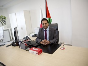 In this Wednesday, Jan. 10, 2018 photo, Palestinian cell phone provider Wataniya CEO Durgham Maraee speaks during an interview with the Associated Press at his office in the West Bank city of Ramallah. Palestinians in the West Bank are finally getting high-speed mobile data services, after a decade-long Israeli ban cost their fragile economy hundreds of millions of dollars, impeded hi-tech start-ups and denied them simple conveniences enjoyed by the rest of the world.