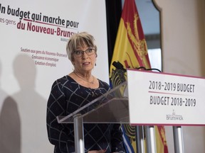 New Brunswick Finance Minister Cathy Rogers speaks at a press conference prior to delivering the provincial budget in the Legislature in Fredericton, N.B., on Tuesday, January 30, 2018.