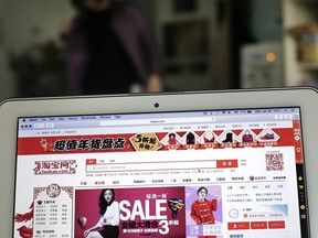 FILE - This Jan. 28, 2015, file photo shows a laptop computer screen displaying the website of Alibaba's Taobao main site at an office in Beijing. China is criticizing recent moves by the U.S. government and Congress targeting the sale of fake goods and Chinese telecoms equipment. Among the Chinese online markets listed was e-commerce giant Alibaba's online marketplace Taobao, which has struggled for years to shed its reputation as an Internet emporium for fake goods.