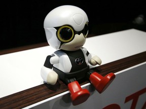 Toyota Motor Corp.'s Kirobo Mini, a compact sized humanoid communication robot, recognizes faces and can manage simple chatter.