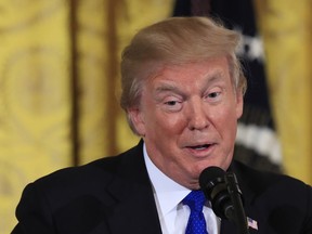 President Donald Trump speaks to a gathering of mayors in the East Room of the White House in Washington, Wednesday, Jan. 24, 2018.