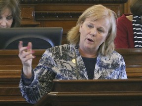 FILE - In this April 3, 2017, file photo, Rep. Susan Concannon, R-Beloit, talks at the Statehouse in Topeka, Kan.  The Trump administration's embrace of work requirements for low-income people on Medicaid is prompting lawmakers in some conservative holdout states to reconsider expanding the program.