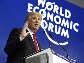 In this Jan. 26, 2018, photo, President Donald Trump speaks at the World Economic Forum in Davos, Switzerland. Just last month, Trump was crowing about his chances for seeing the U.S. post 3 percent economic growth in 2017 and scoffing at the skeptics who predicted much less. Turns out the skeptics _ actually, mainstream economists _ were right and he was wrong. This became clear Friday just as Trump was speaking about an America "roaring back" in remarks at the World Economic Forum in Davos.