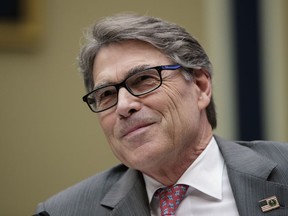 FILE - In this Oct. 12, 2017, file photo,Energy Secretary Rick Perry listens during a hearing about the electrical grid, on Capitol Hill in Washington. The Federal Energy Regulatory Commission on Jan. 8, 2018, rejected a Trump administration plan to bolster coal-fired and nuclear power plants, dealing a blow to President Donald Trump's efforts to boost the struggling coal industry. Perry thanked the panel for addressing his proposal, which he said had initiated a national debate on the resiliency of the nation's electric system.