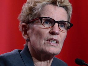 Kathleen Wynne wants the Tim Horton franchise owners to reverse their decision to cut employee benefits in response to the province's increased minimum wage.