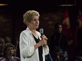 Ontario Premier Kathleen Wynne addresses questions from the public during a town hall meeting in Toronto on Nov. 20, 2017.