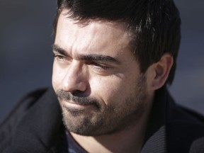 In this photo taken Jan. 19 2018, Nuno Mendes pauses during an interview with The Associated Press, in Lisbon. The 40-year-old Portuguese government worker lives from six-month contract to six-month contract, doing the same job every day but never sure of his future. Unlike his co-workers on permanent contracts, banks won't even give him a mortgage.