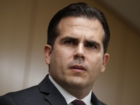 FILE - In this Nov. 13, 2017 file photo, Puerto Rico Gov. Ricardo Rossello speaks during a news conference, in Washington. Rosello said on Monday, Jan. 22, 2018, that he is privatizing the island's government-owned power company following decades of mismanagement, corruption and blackouts.