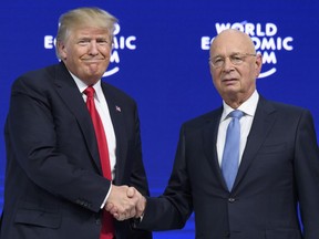 U.S. President, Donald Trump, left, shakes hands with German Klaus Schwab, Founder and Executive Chairman of the World Economic Forum, WEF on the last day of the annual meeting of the World Economic Forum, WEF, in Davos, Switzerland, Friday, Jan. 26, 2018.