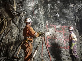 Mine workers are shown in a handout photo from Acacia Mining.