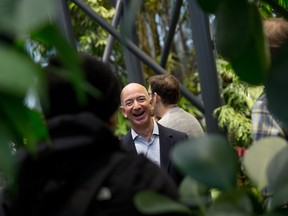 Jeff Bezos, founder and chief executive officer of Amazon.com Inc., tours the Spheres, a new gathering and working space for employees in Seattle